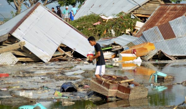 A man surveys the damage caused by earthquake and tsunami in Palu, Central Sulawesi, Indonesia, Saturday, Sept. 29, 2018. The powerful earthquake rocked the Indonesian island of Sulawesi on Friday, triggering a 3-meter-tall (10-foot-tall) tsunami that an official said swept away houses in at least two cities. (AP Photo/Rifki)